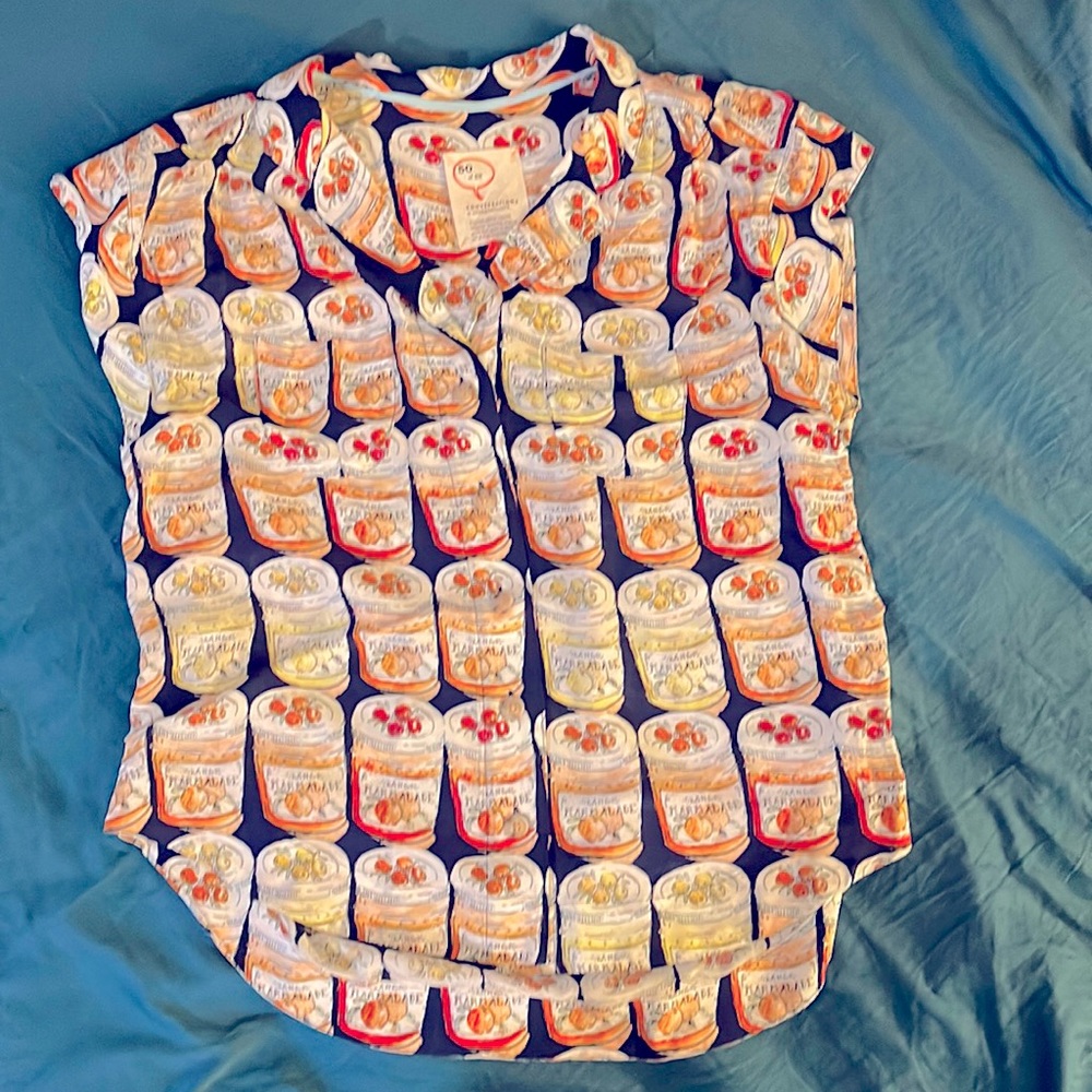 Super cute button down blouse with fruit marmalade print.